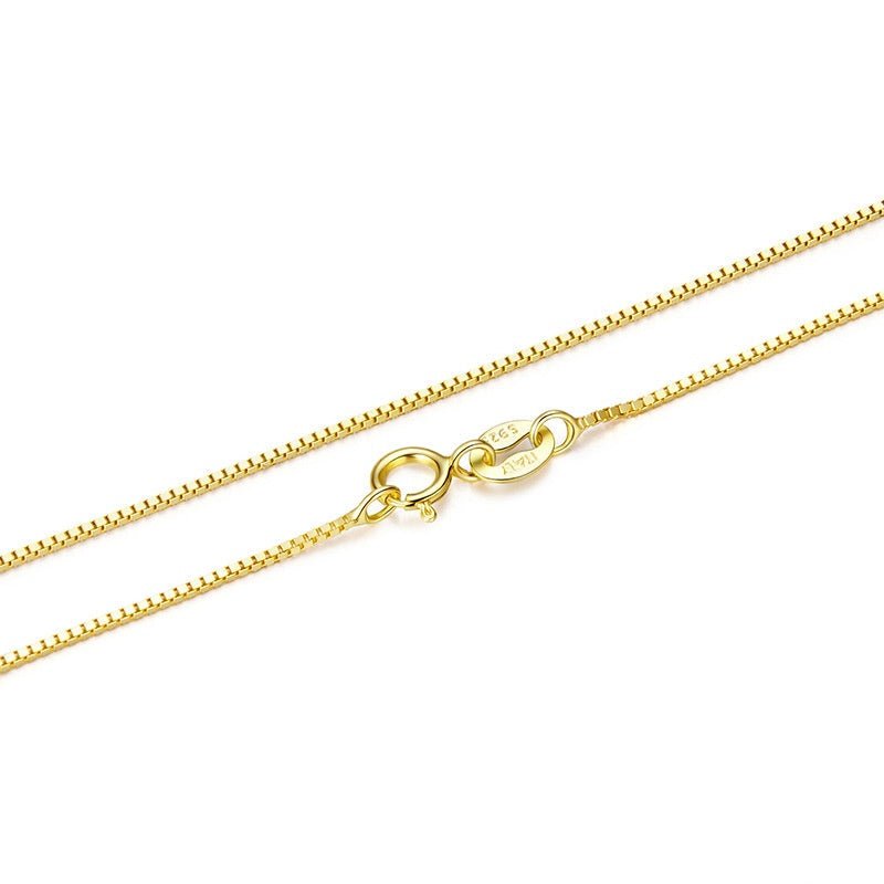 Gold chain necklace on a white background
