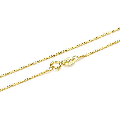 Gold chain necklace on a white background
