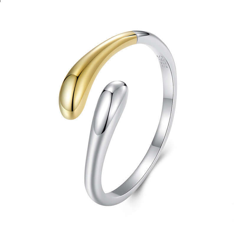 Two-tone gold and silver ring on a white background