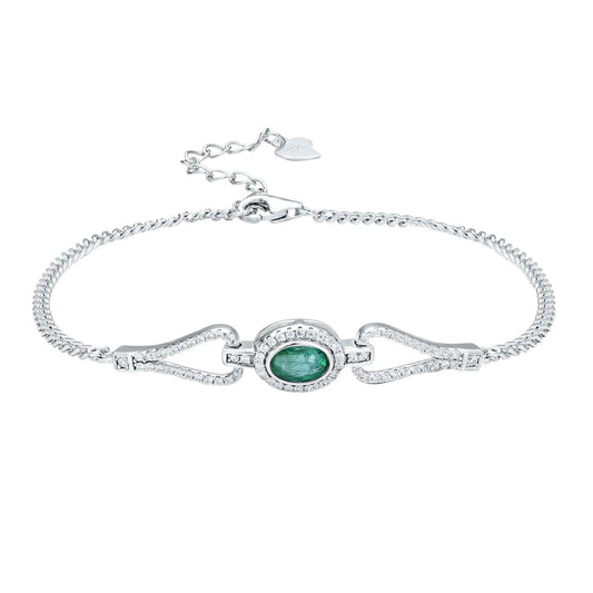 Silver bracelet with a green emerald gemstone and white zirconia stones on a white background
