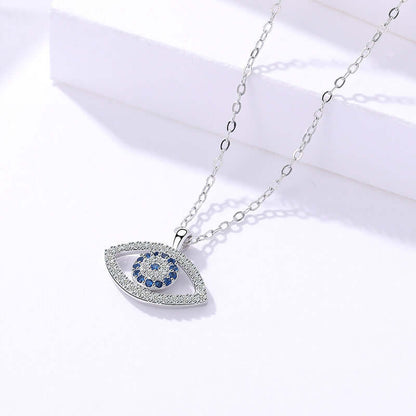 Silver necklace with an eye-shaped pendant featuring blue stones on a white background