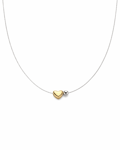 Necklace with a gold heart-shaped pendant on a white background