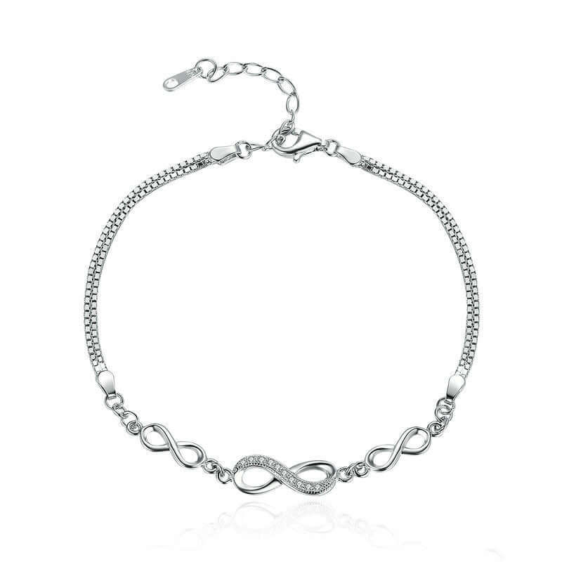 Silver bracelet with infinity design on a white background