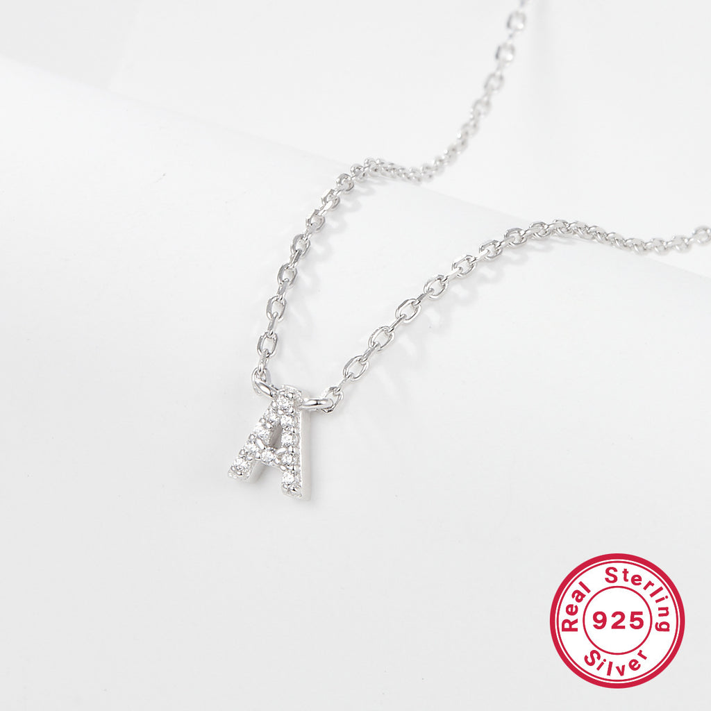 Silver necklace with a letter 'A' pendant on a white background, featuring a 'Real Sterling Silver 925' stamp.