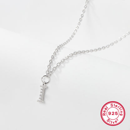 Silver necklace with a letter 'I' pendant on a white background, featuring a 'Real Sterling Silver 925' stamp.