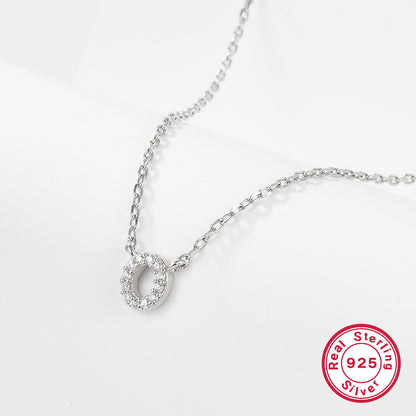 Silver necklace with a letter 'O' pendant on a white background, featuring a 'Real Sterling Silver 925' stamp.