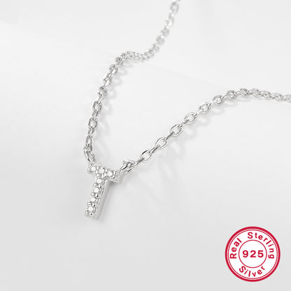 Silver necklace with a letter 'T' pendant on a white background, featuring a 'Real Sterling Silver 925' stamp.