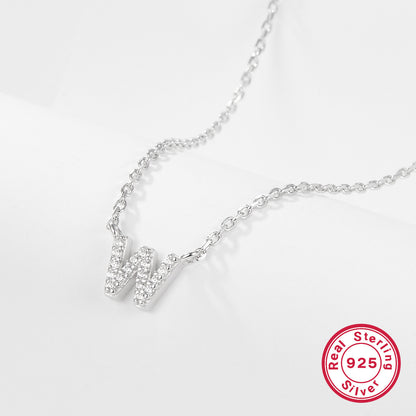 Silver necklace with a letter 'W' pendant on a white background, featuring a 'Real Sterling Silver 925' stamp.