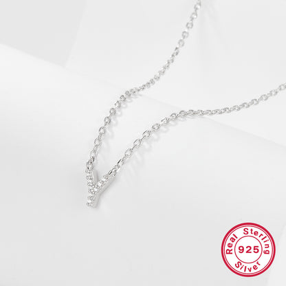 Silver necklace with a letter 'Y' pendant on a white background, featuring a 'Real Sterling Silver 925' stamp.