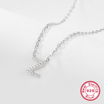 Silver necklace with a letter 'Z' pendant on a white background, featuring a 'Real Sterling Silver 925' stamp.
