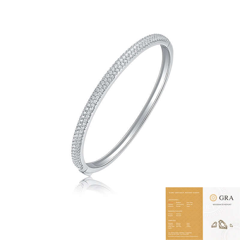 Silver bracelet with moissanites on a white background, featuring the GRA logo.