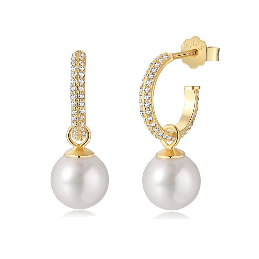 Gold hoop earrings with pearl drops on a white background