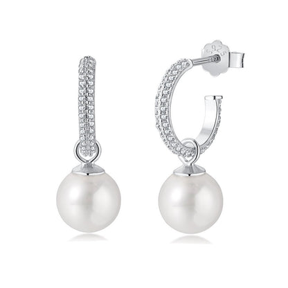 Pearl earrings with silver and diamond accents on a white background