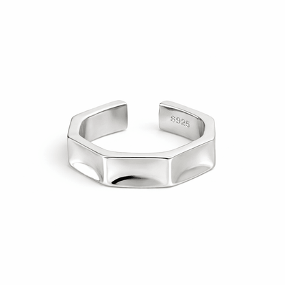 Silver hexagonal ring on a white background