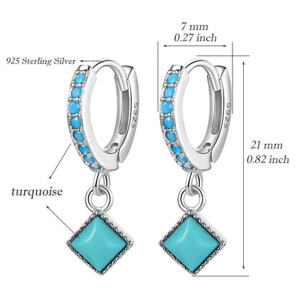 Silver hoop earrings with turquoise stones and measurements on a white background