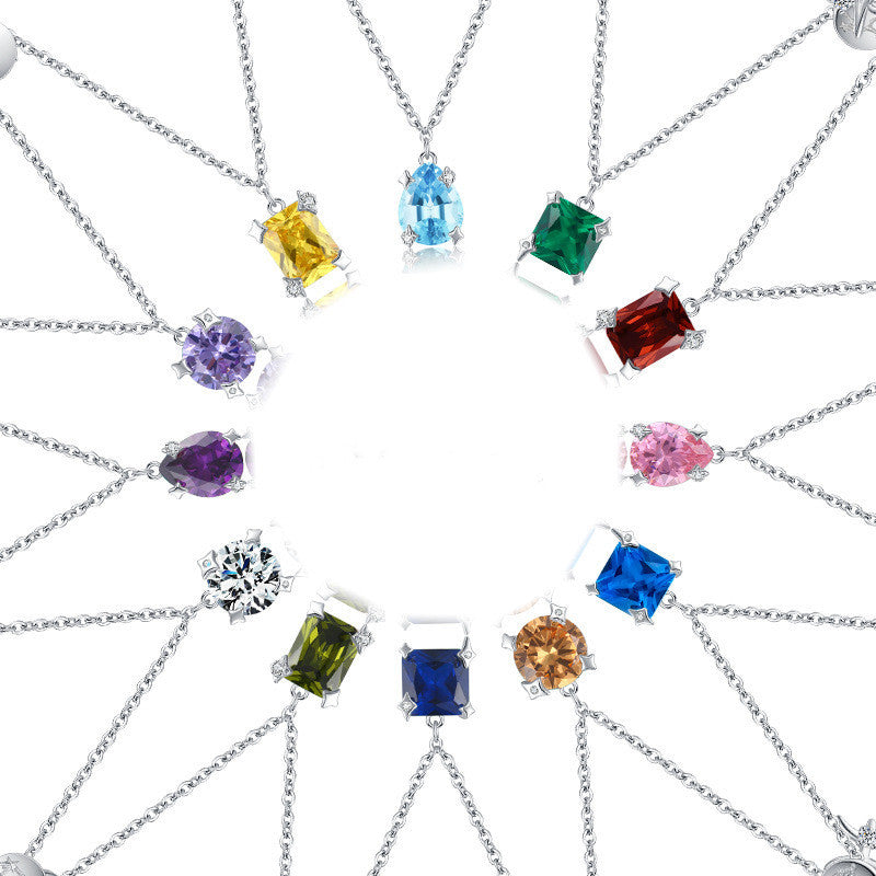 Collection of necklaces with various colored gemstones on a white background