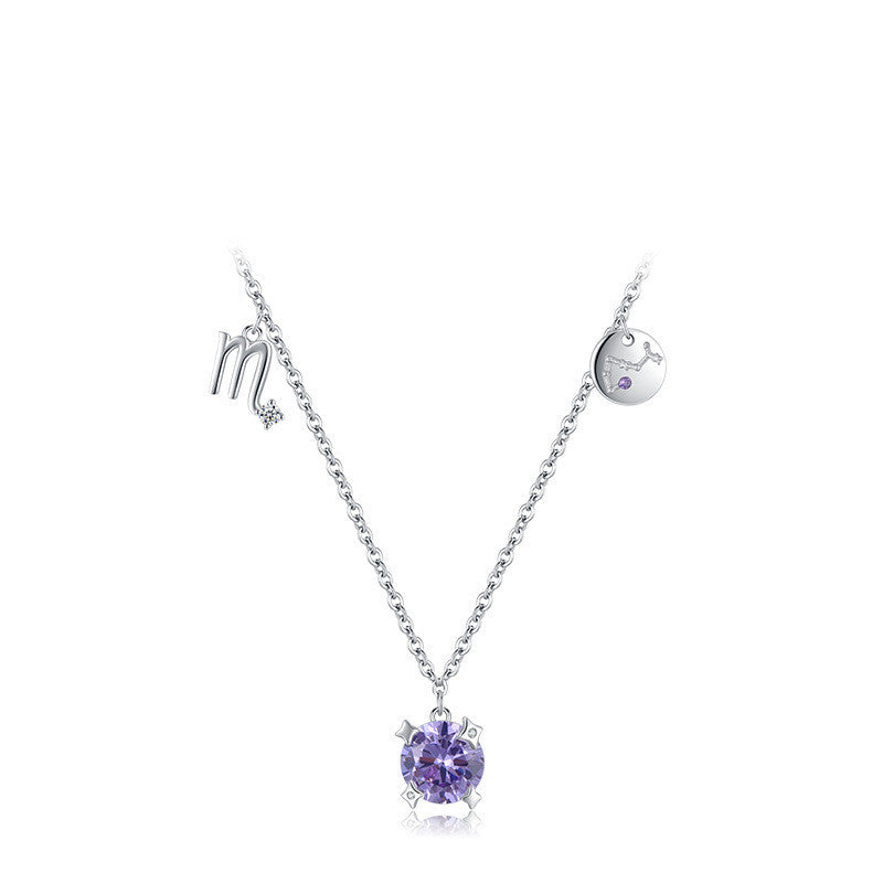 Silver necklace with a  round purple pendant on a white background