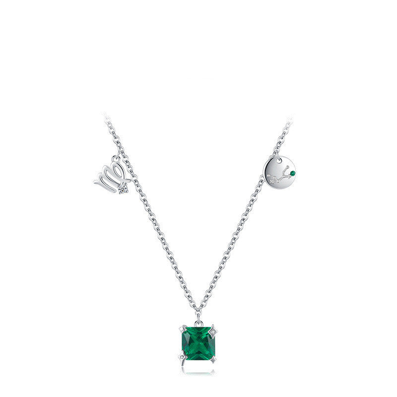 Silver necklace with a square green gemstone pendant on a white background