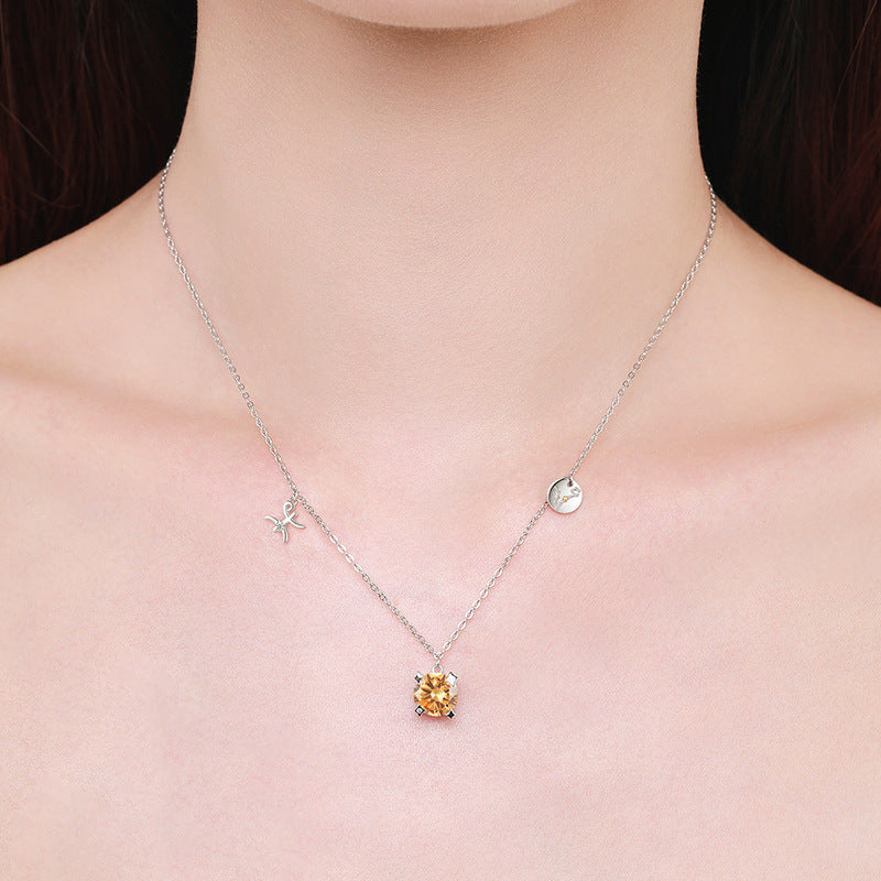 Necklace with an orange gemstone pendant on a person's neck