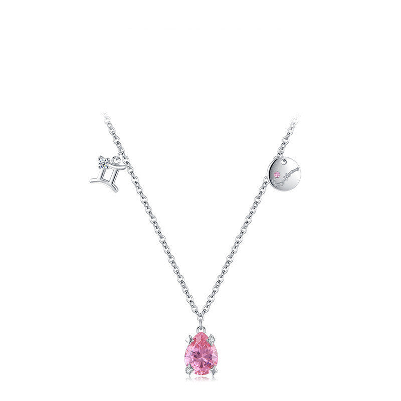 Necklace with a pink teardrop pendant on a white background