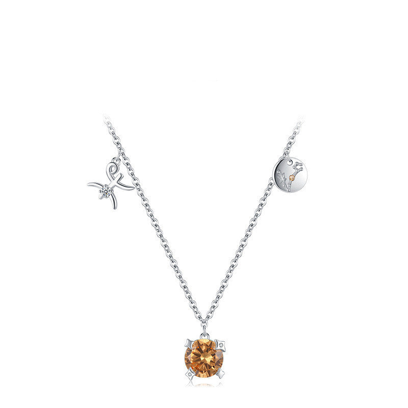 Silver necklace with an orange gemstone pendant on a white background
