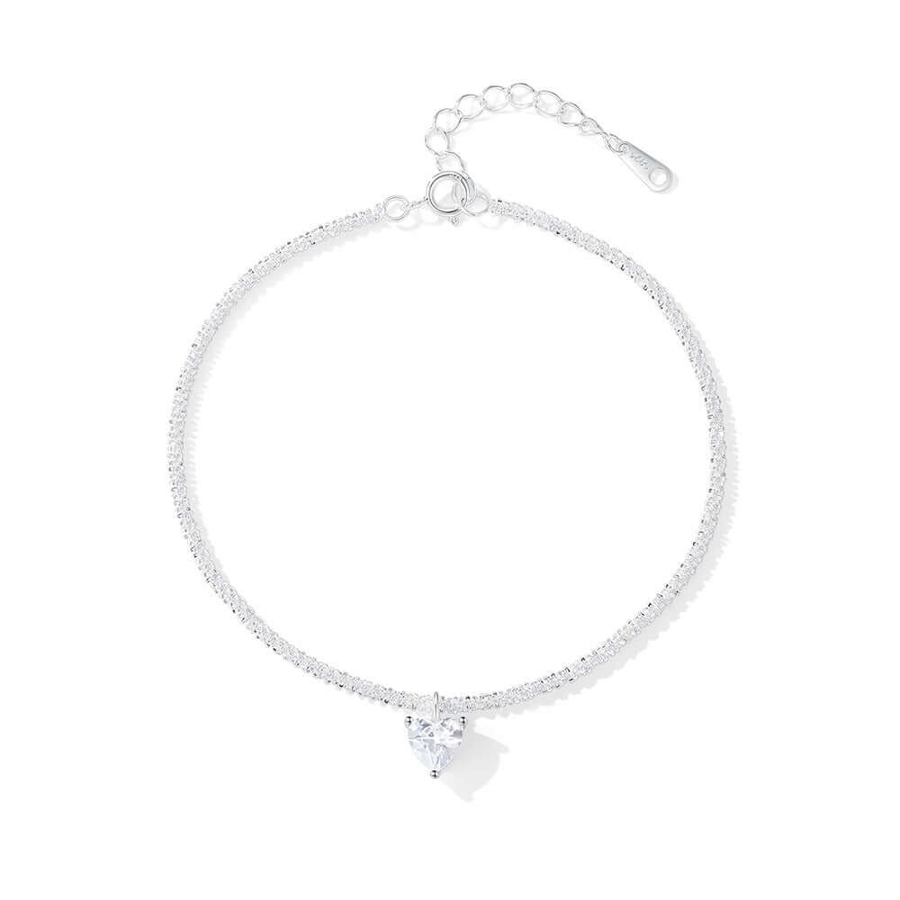 Silver bracelet with a heart-shaped charm on a white background.