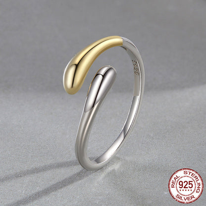 Two-tone gold and silver ring on a gray background with 'Real Sterling Silver 925' stamp.