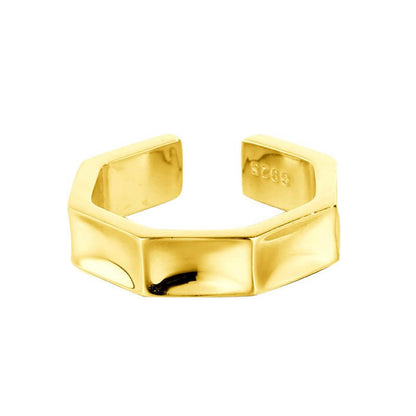 Gold hexagonal ring on a white background