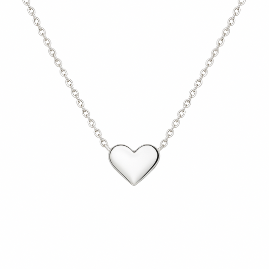 Silver heart-shaped pendant on a chain against a white background