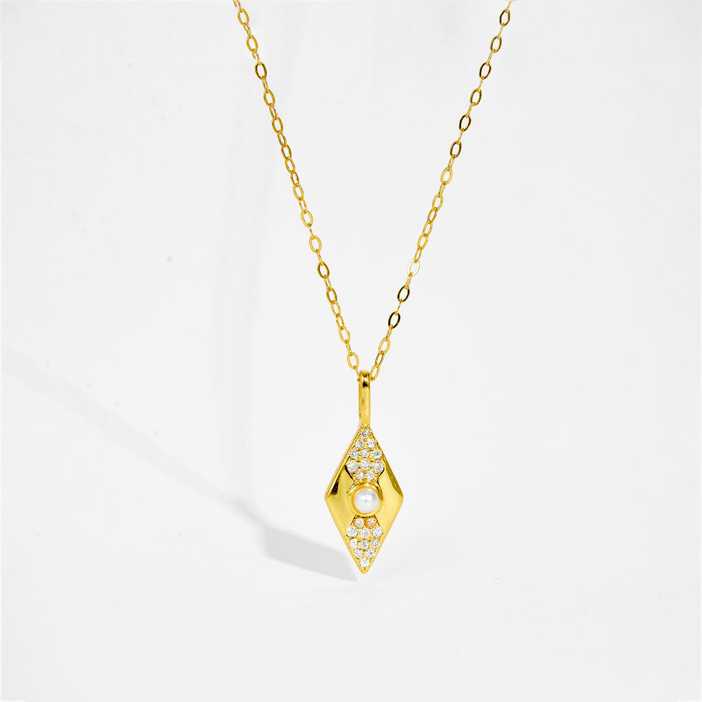 Gold color necklace with a diamond-shaped pendant on a white background
