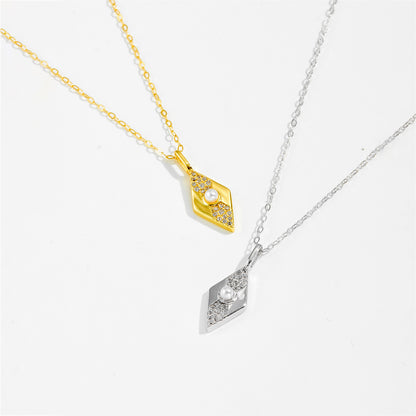 Two diamond-shaped pendants on gold and silver colors chains against a white background