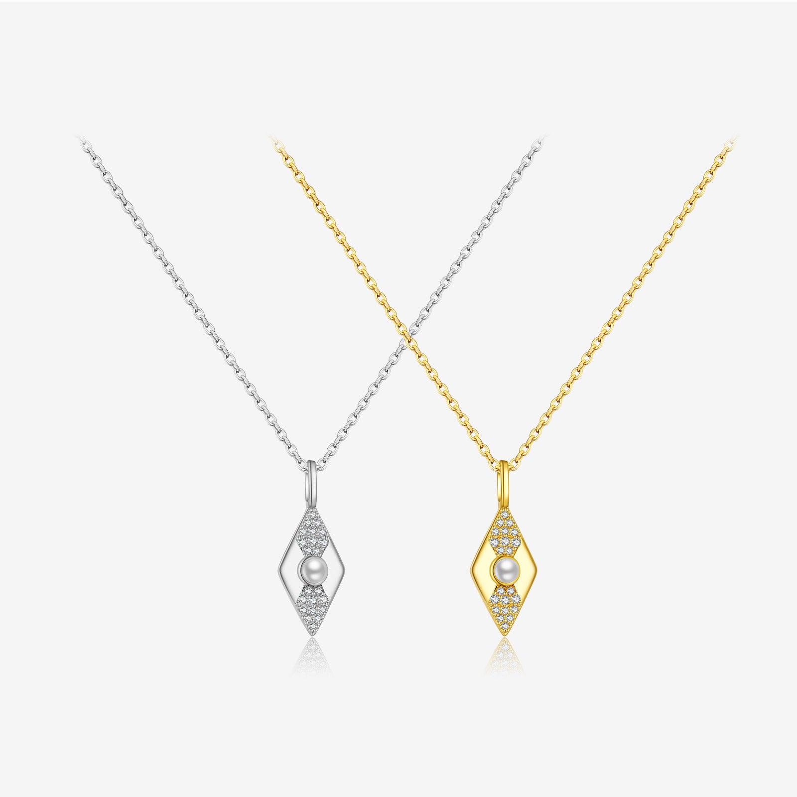 Two diamond-shaped necklaces, one gold and one silver, on a white background.
