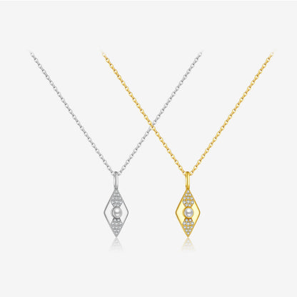 Two diamond-shaped necklaces, one gold and one silver, on a white background.